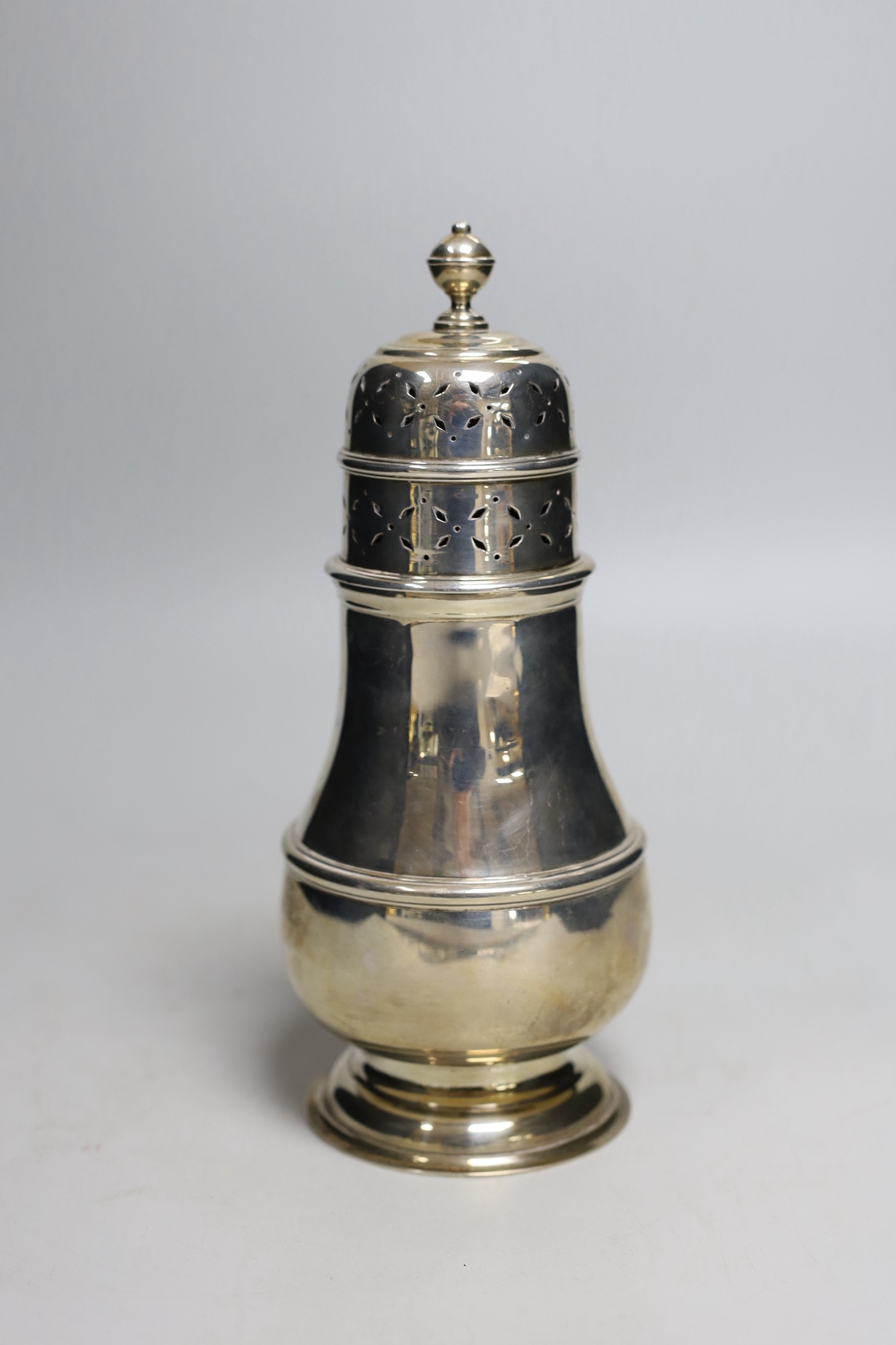 A large Edwardian silver baluster sugar caster, Charles Stuart Harris, London, 1902, 22.3cm, 13.2oz.